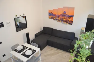 a living room with a couch and a table at Apartment Silvestri in Rome