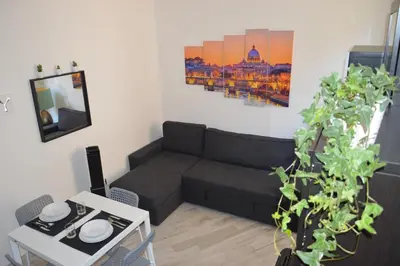a living room with a couch and a table at Apartment Silvestri in Rome