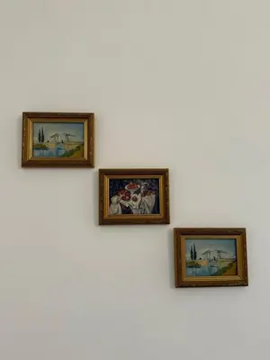 a bed in a small room with two windows at Soggiorno Emanuela in Rome
