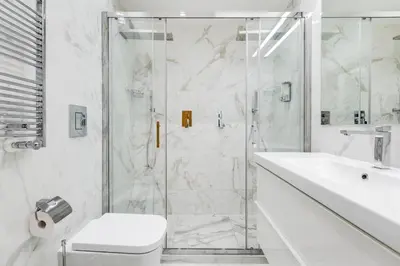 a bathroom with a shower and a toilet and a sink at ELICAL Luxury Apartments in Rome