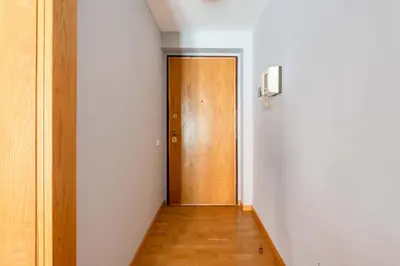a hallway with a wooden door in a room at ELICAL Luxury Apartments in Rome