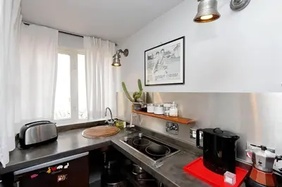 a kitchen with a sink and a counter top at Scala Luxury Terrace studio in Rome