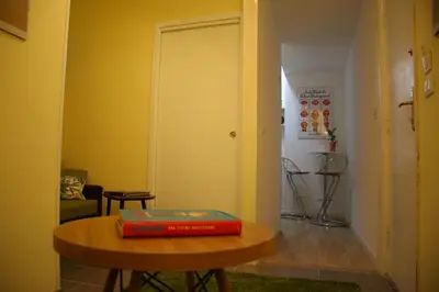 a red book sitting on a table in a room at Mila Guest House in Rome