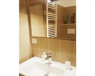 a bathroom with a sink and a mirror at B&B Emozioni Romane in Rome