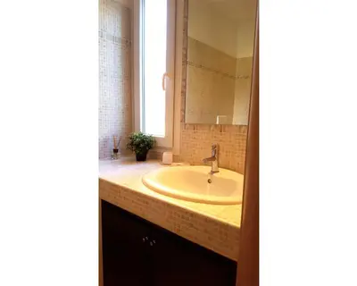 a bathroom with a sink and a mirror at B&B Emozioni Romane in Rome