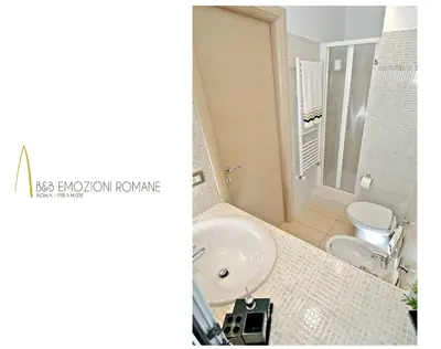 a bathroom with a sink and a toilet at B&B Emozioni Romane in Rome