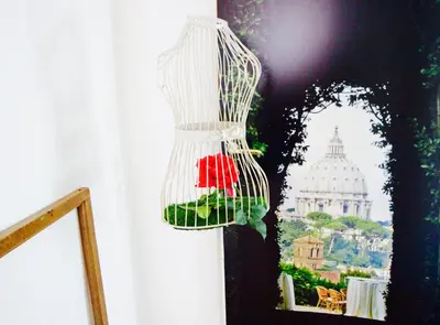 a chandelier hanging from a wall with a picture at Jacuzzi Rooms in Rome