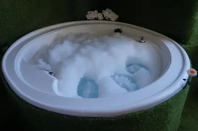 a bath tub filled with snow and clouds at Jacuzzi Rooms in Rome