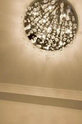 a chandelier in a room with a ceiling at Suites Roma Tiburtina Economy in Rome