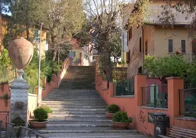 a set of stairs leading up to some buildings at LA PERLA RARA Vatican Sweet Home in Rome
