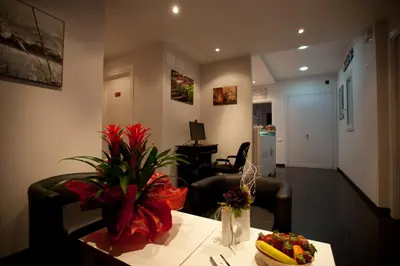 a living room with a table with a bowl of fruit on it at Heart of Rome Rooms in Rome