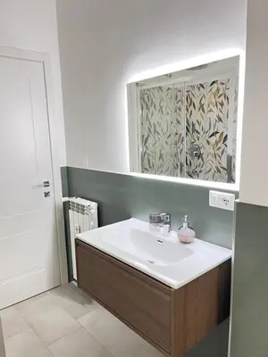 a bathroom with a sink and a mirror at Le Naiadi in Rome