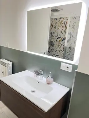 a bathroom with a white sink and a mirror at Le Naiadi in Rome