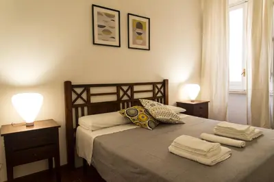 a bedroom with a bed with towels on it at Le Naiadi in Rome