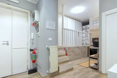 a hallway with stairs and a stair case at Comfort Rooms Piazza Mariano Armellini in Rome