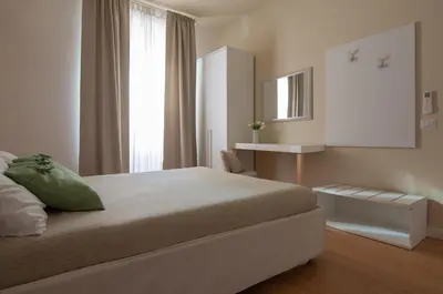 a bedroom with a large bed and a window at Urbanflat Repubblica Square in Rome