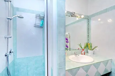 a bathroom with a sink and a shower at THE ROMAN NEST ai Musei Vaticani in Rome