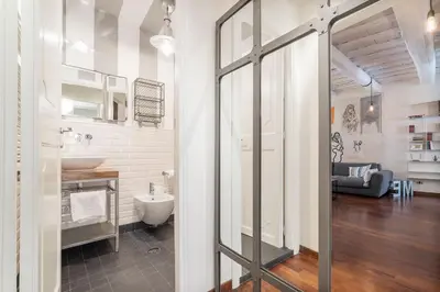 a bathroom with a sink and a mirror at CS Spanish Steps Apartment in Rome
