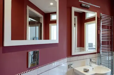 a bathroom with two mirrors and a sink at Rome in Rome in Rome