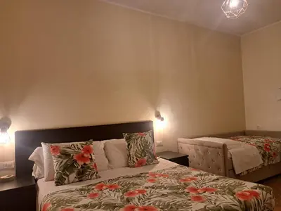 a bedroom with a bed with flowers on it at Eco B&B Marela in Rome