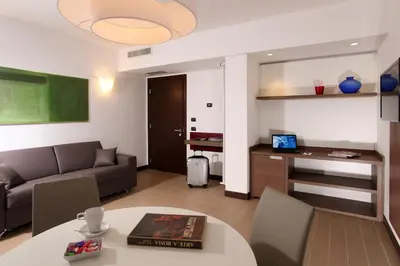 a living room with a couch and a table at Residence Hotel Parioli in Rome
