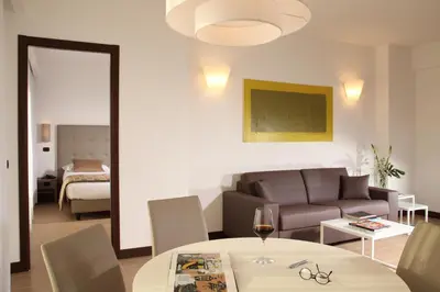 a living room with a couch and a table at Residence Hotel Parioli in Rome