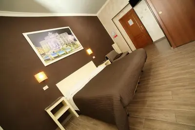 a bedroom with a bed in a hotel room at Hotel Giugiù in Rome