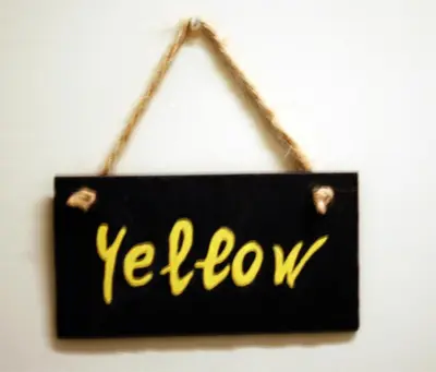 a black and yellow sign hanging on a wall at Paola Guest House in Rome