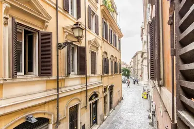 an alley in the city with buildings at Pop House in Rome