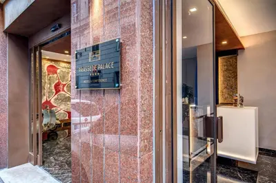 a sign on the wall of a building at Prassede Palace Hotel in Rome
