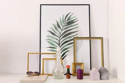 a table with two mirrors and a vase with a plant at ROMAC Gianicolo 3-Bedroom Holiday Apartment in Rome