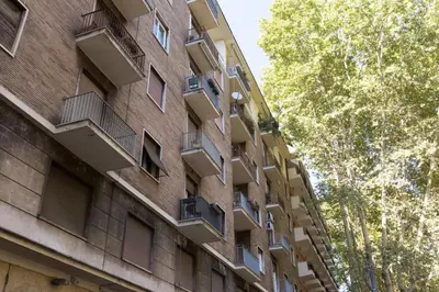 an apartment building with balconies on the side of it at ROMAC Gianicolo 3-Bedroom Holiday Apartment in Rome