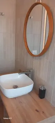 a bathroom with a white sink and a mirror at Old Bakery Rome Suites & Apartments in Rome