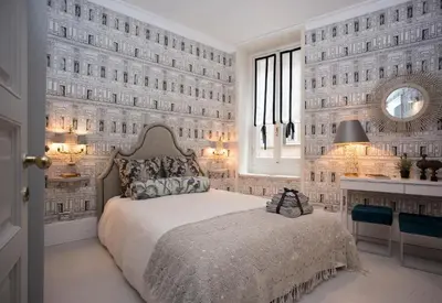 a white bedroom with a bed and a wall of windows at Roma Fontana di Trevi in Rome