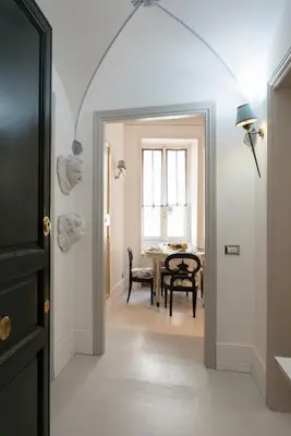 a hallway with a table and a dining room at Roma Fontana di Trevi in Rome