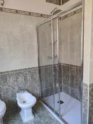 a bathroom with a toilet and a sink and a tub at Fly B&B in Rome