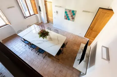 an overhead view of a dining room table and chairs at Experience Collection by ROMAC - Margana Palace in Rome
