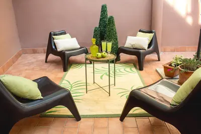 a room with three chairs and a table and plants at Apartment Rome & More in Rome