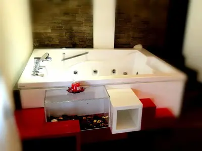 a lego bathroom with a sink and a red floor at Caos Calmo in Rome