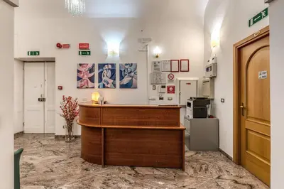 a lobby with a reception desk in a room at Hotel Katty in Rome