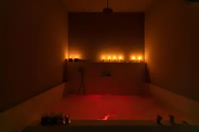 a dark room with a red floor and lights at ROMAC Fontanella Borghese Palace in Rome