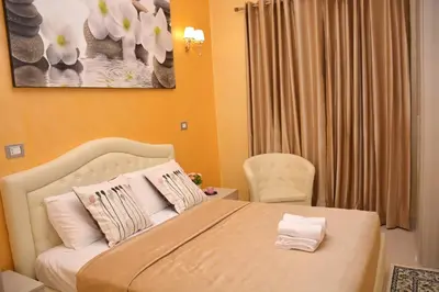 a bedroom with a bed and a chair at Rome Innitaly Affittacamere o GuestHouse in Rome