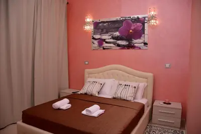 a bedroom with a bed with two towels on it at Rome Innitaly Affittacamere o GuestHouse in Rome
