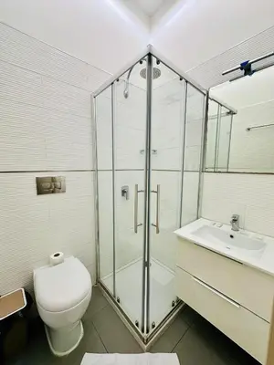 a bathroom with a shower and a toilet and a sink at Rome Innitaly Affittacamere o GuestHouse in Rome