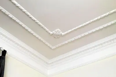 a coffered ceiling with white molding at Modern Apartment Quirina 300 mt from Vatican in Rome