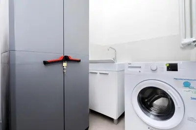 a refrigerator and a washing machine in a room at Modern Apartment Quirina 300 mt from Vatican in Rome