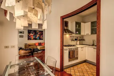 a kitchen with a glass table in a room at Pellegrino in Rome