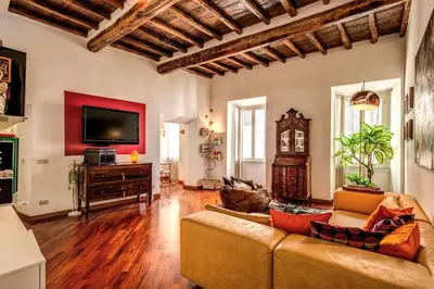 a living room with a couch and a flat screen tv at Pellegrino in Rome