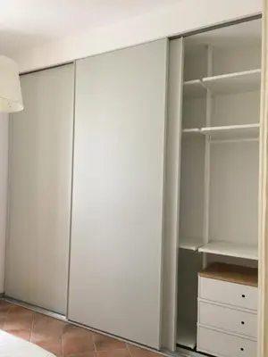 a walk in closet with white doors at Elegant Apartment in the Center of Rome! in Rome