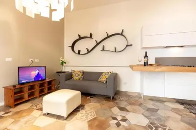 a living room with a couch and a tv at Elegant Apartment in the Center of Rome! in Rome